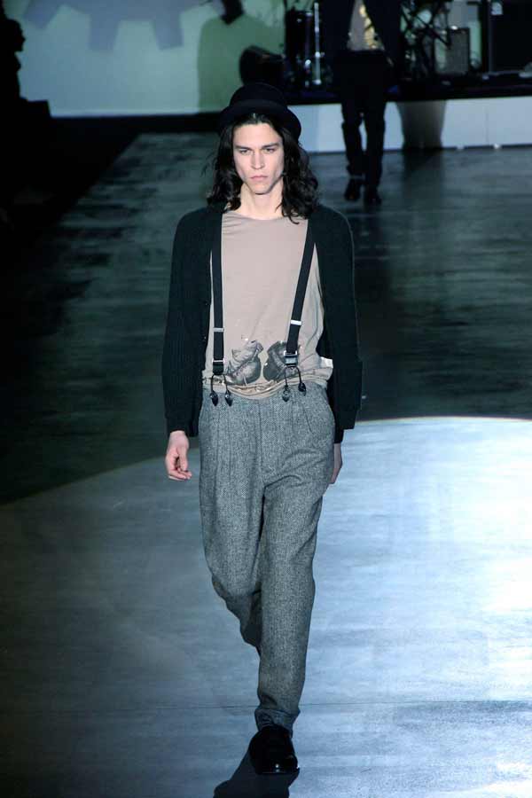 Fashion label Iceberg shows of its suspenders at a catwalk in 2013.