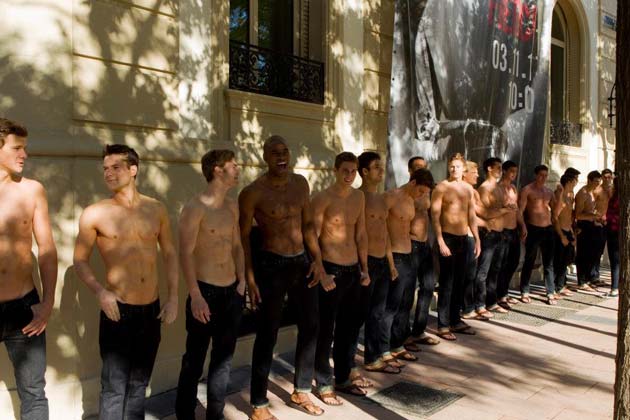 Abercrombie & Fitch - Staff lining up showing their muscles.