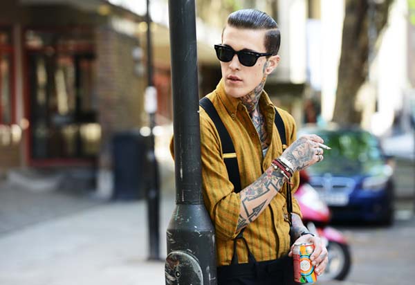 Braces Suspenders are very cool - guy with shirt braces and tattoos