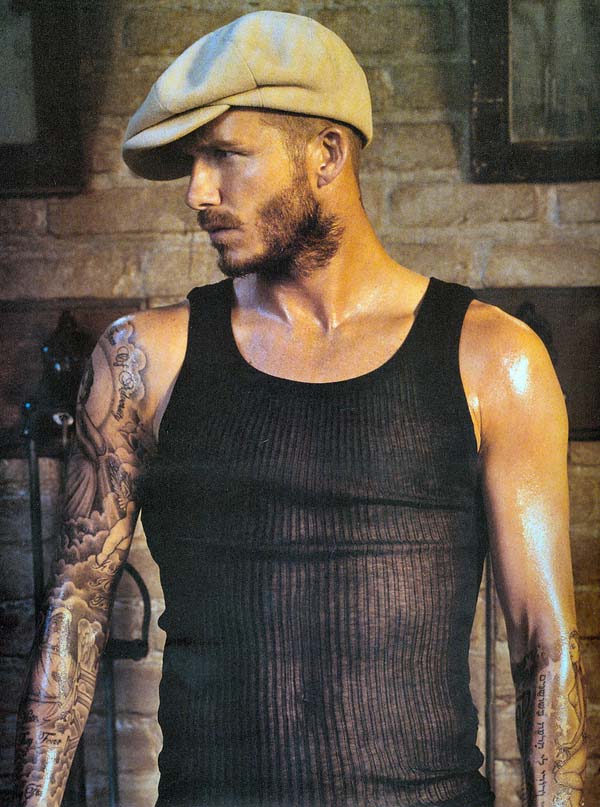 David Beckham Master of the modern Tattoo and wearing a hat