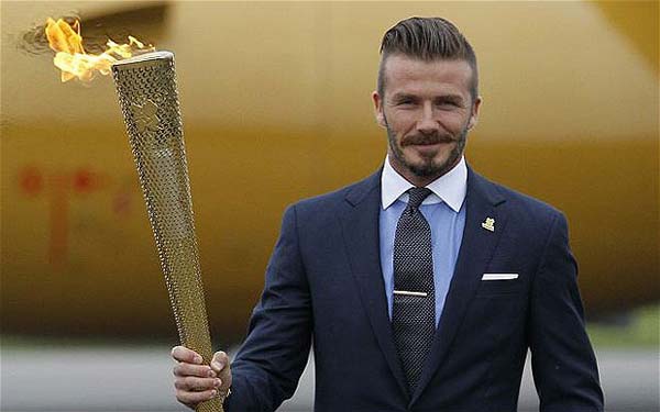 David Beckham as the Olympic ambassador wearing the Torch