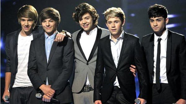 one-direction-on-stage-during-beetles-week,wearing-blazers