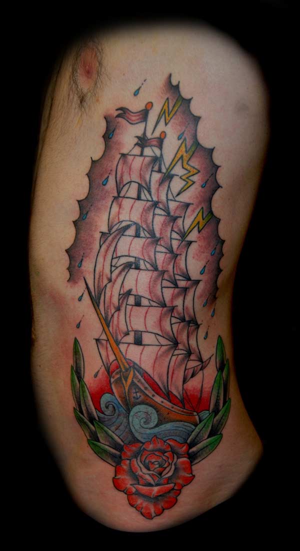 tattoo side torso of a sailing boat