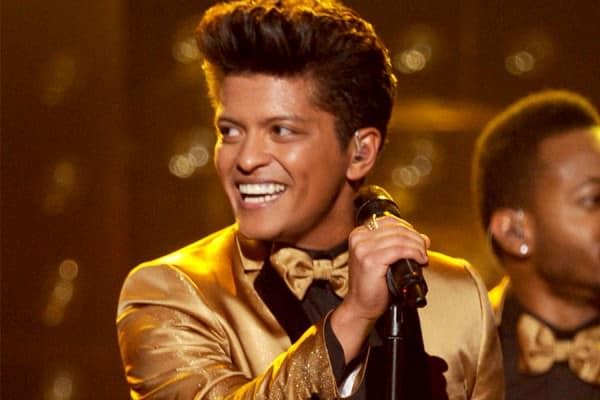 Bruno Mars wearing a gold suit
