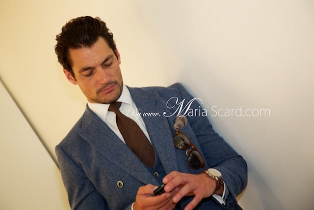 David Gandy in blue suit at London Collections Men event - checking his mobile