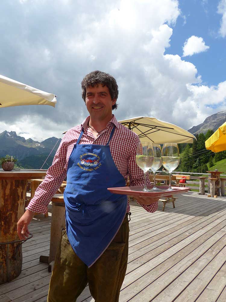 Our friendly waiter in South Tyrol with Hugo cocktails.