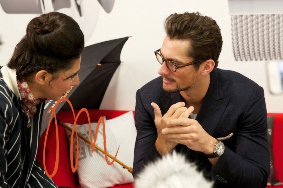 Gracie Opulanza in conversation with David Gandy at London Collections: Men 2013, both mid-discussion, photographed by Maria Scard for MenStyleFashion